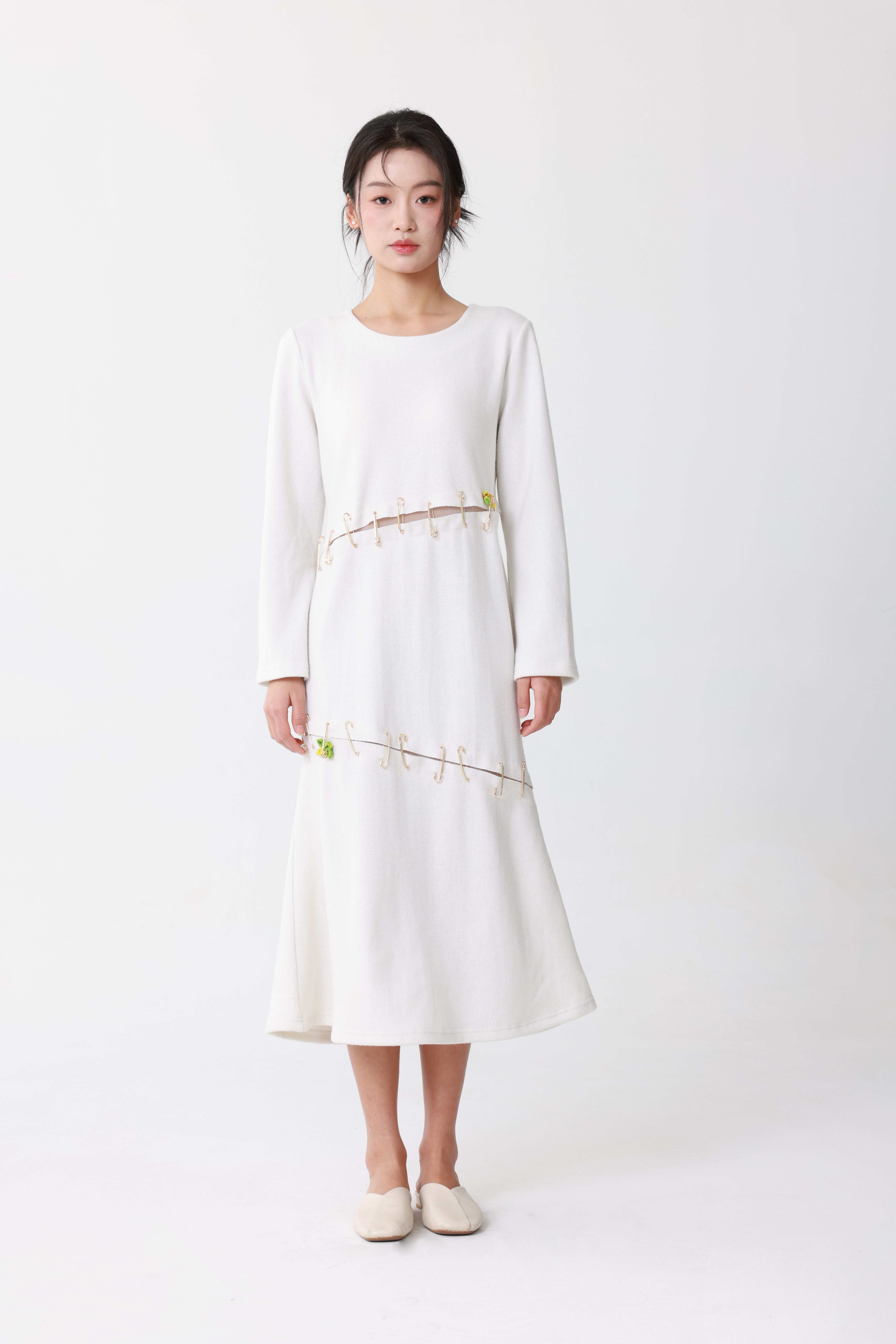 White dress with decorative pins